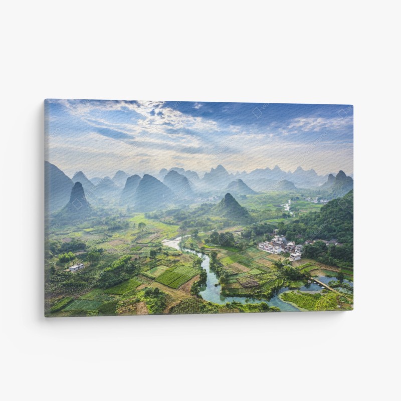 Quadro su tela panorama di risaie e montagne carsiche all'alba