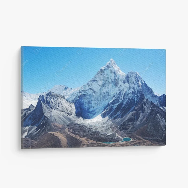 Quadro su tela maestosa cima innevata e lago alpino
