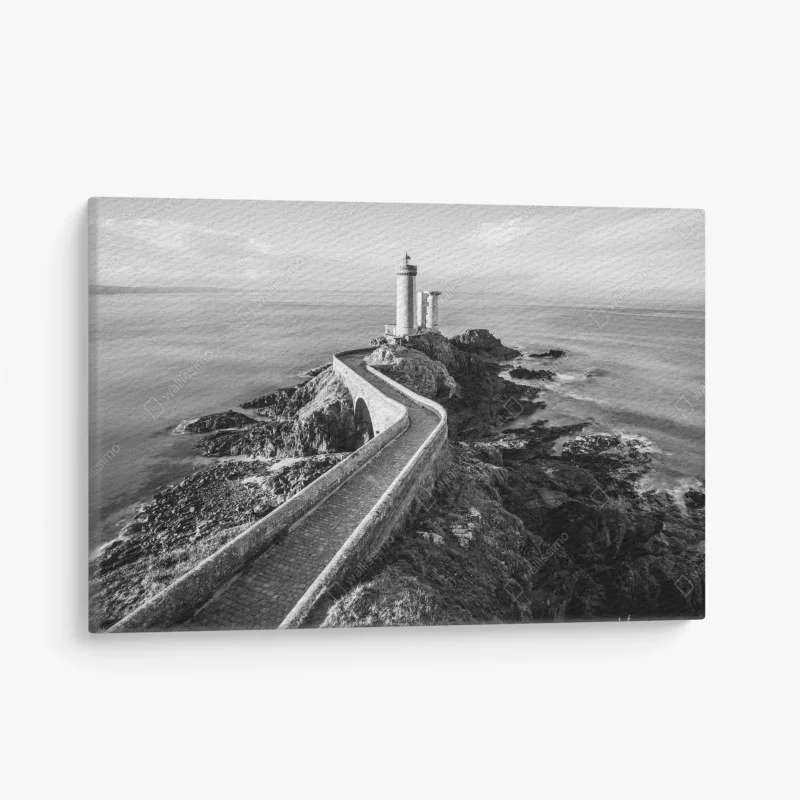 Quadro su tela faro solitario sulla scogliera con passerella