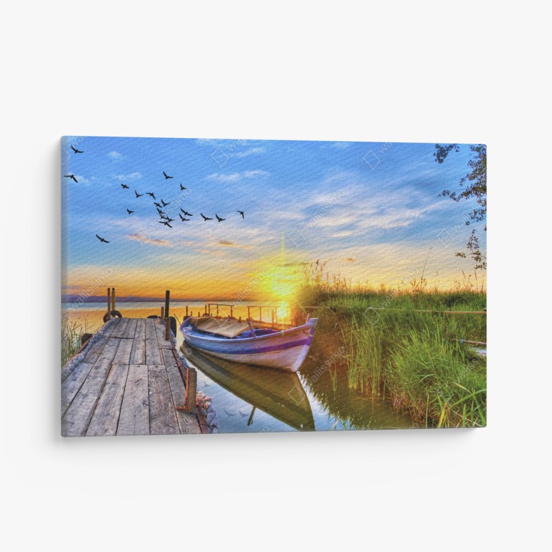 Quadro su tela tramonto sul lago con barca e molo