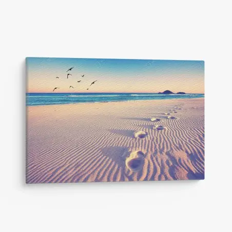 Quadro su tela impronte magiche sulla spiaggia al tramonto • Wallissimo®