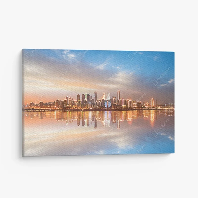 Quadro su tela panorama urbano al tramonto riflesso sull'acqua