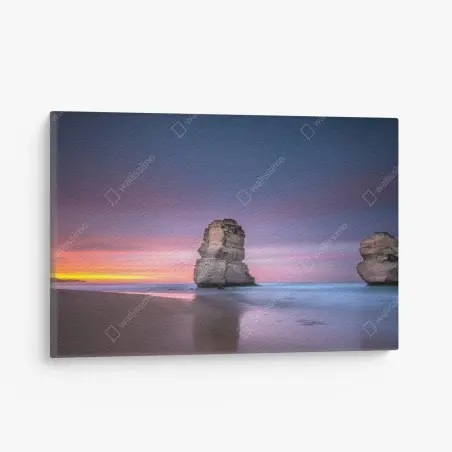 Quadro su tela tramonto tra faraglioni sul mare • Wallissimo®