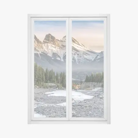 Adesivo per finestra tramonto sulle cime innevate con foresta e ruscello • Wallissimo®