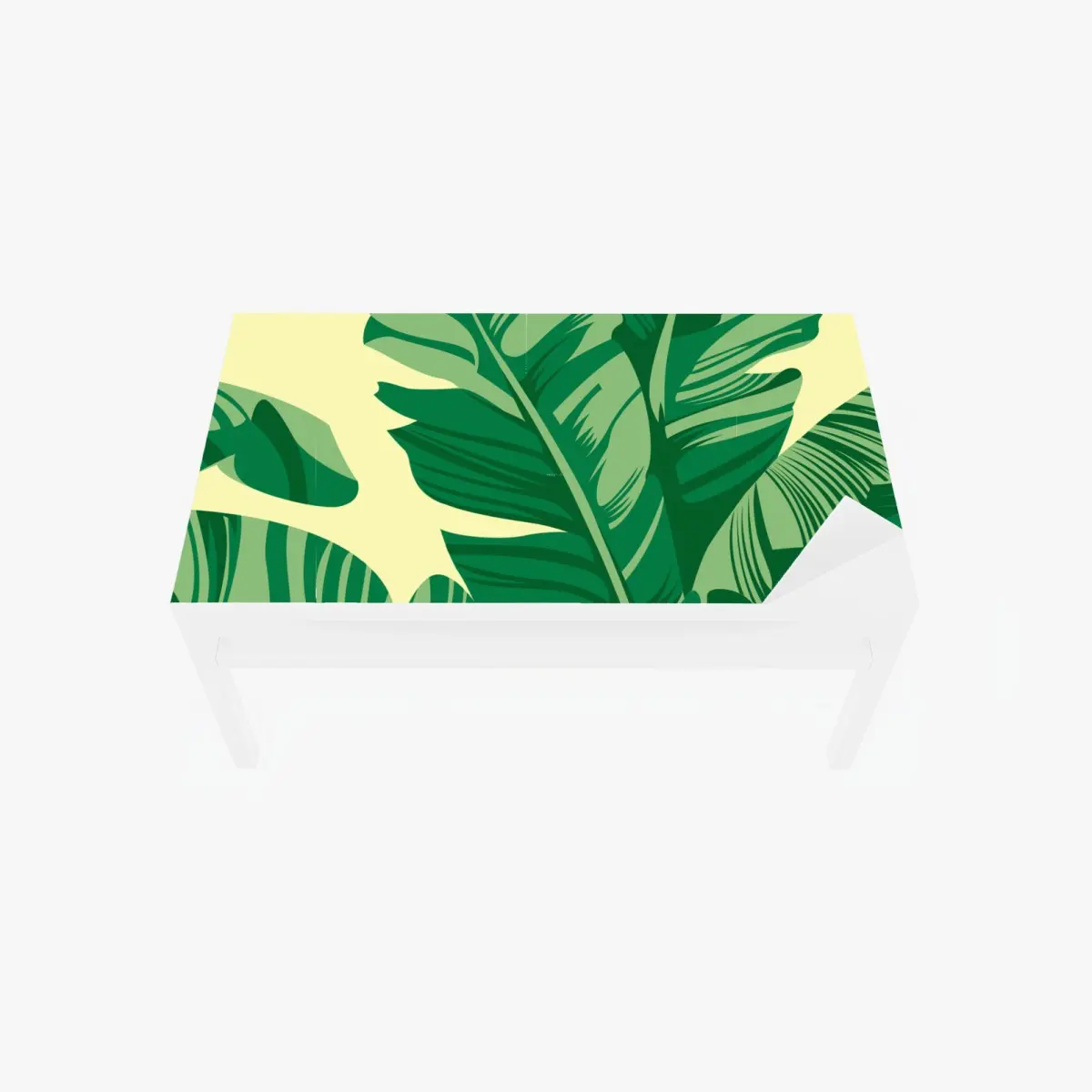 Adesivo per tavolo e scrivania motivo foglie tropicali verdi su sfondo giallo • Wallissimo®