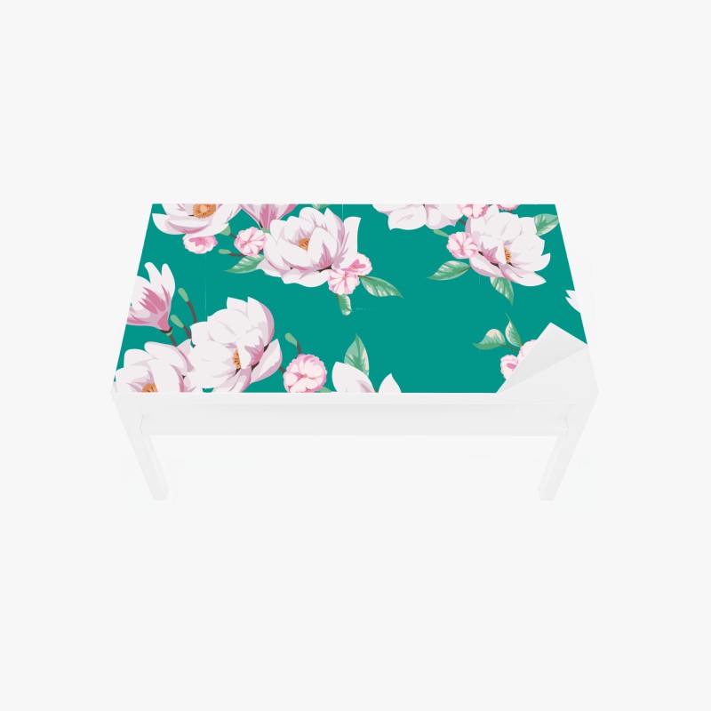 Adesivo per tavolo e scrivania magnolie delicate su sfondo turchese