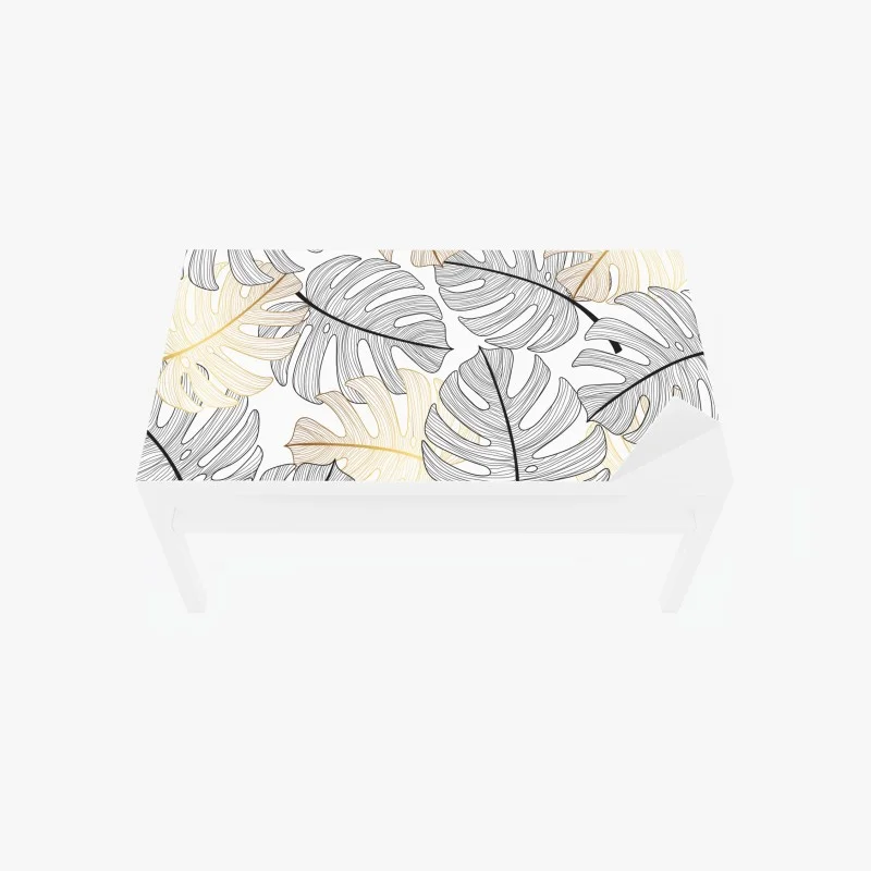 Adesivo per tavolo e scrivania eleganza botanica: foglie di monstera in oro e nero