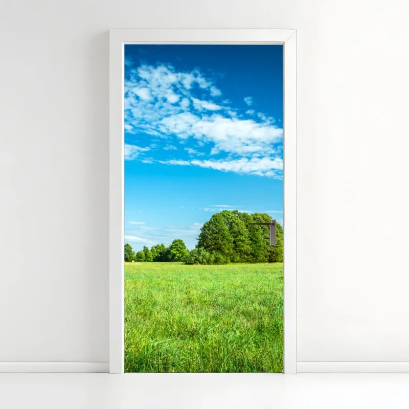 Adesivo per porta prateria verde sotto cielo azzurro