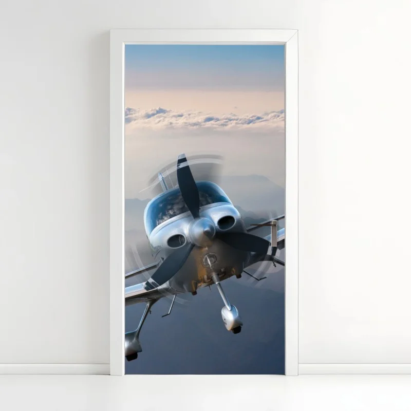 Adesivo per porta aeroplano elegante in volo sopra le montagne