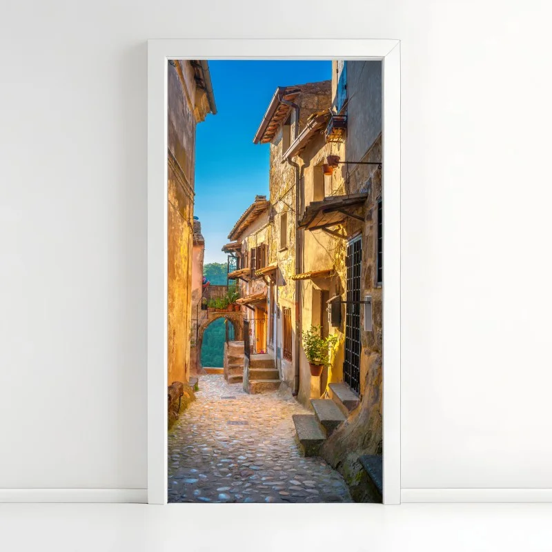 Adesivo per porta vicoletto medievale in Toscana al tramonto