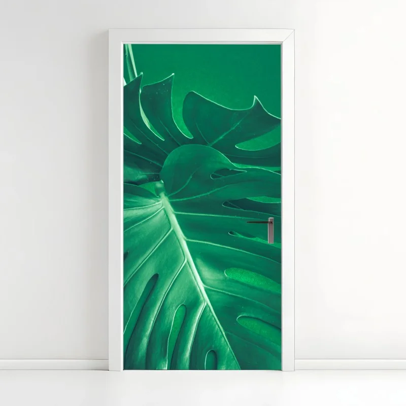 Adesivo per porta elegante foglia di monstera su sfondo verde