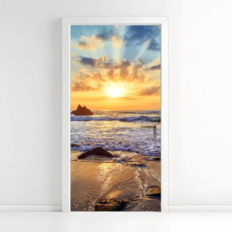 Adesivo per porta tramonto dorato sulla costa rocciosa