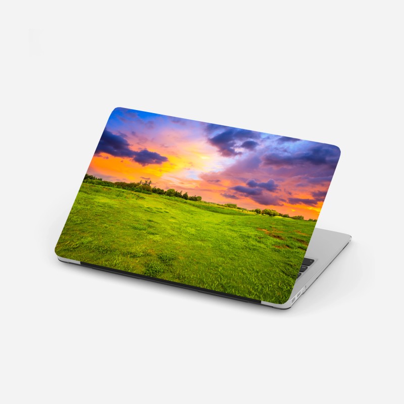 Adesivo per laptop tramonto sul prato verde
