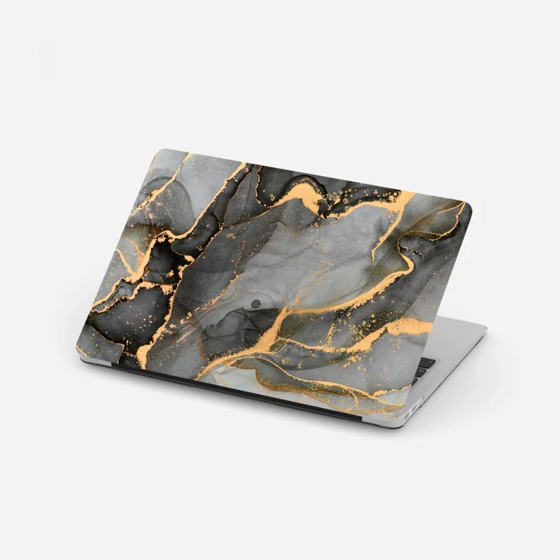 Adesivo per laptop correnti dorate su marmo grigio