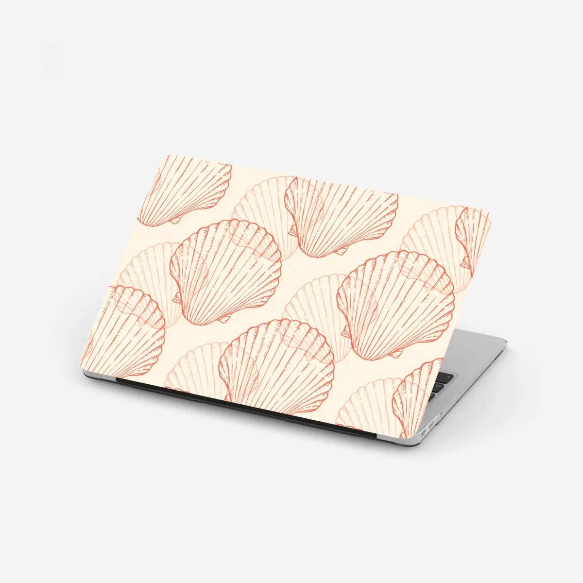 Adesivo per laptop motivo di conchiglie corallo su sfondo beige • Wallissimo®