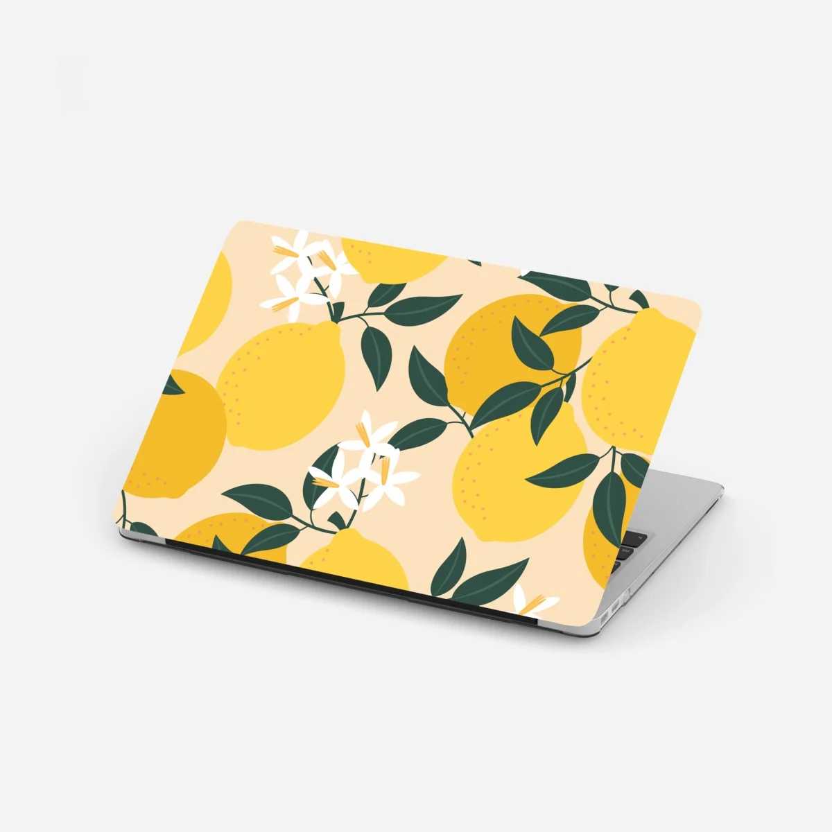 Adesivo per laptop motivo di limoni e fiori su sfondo beige • Wallissimo® Adesivo per laptop motivo di limoni e fiori su sfondo beige • Wallissimo®