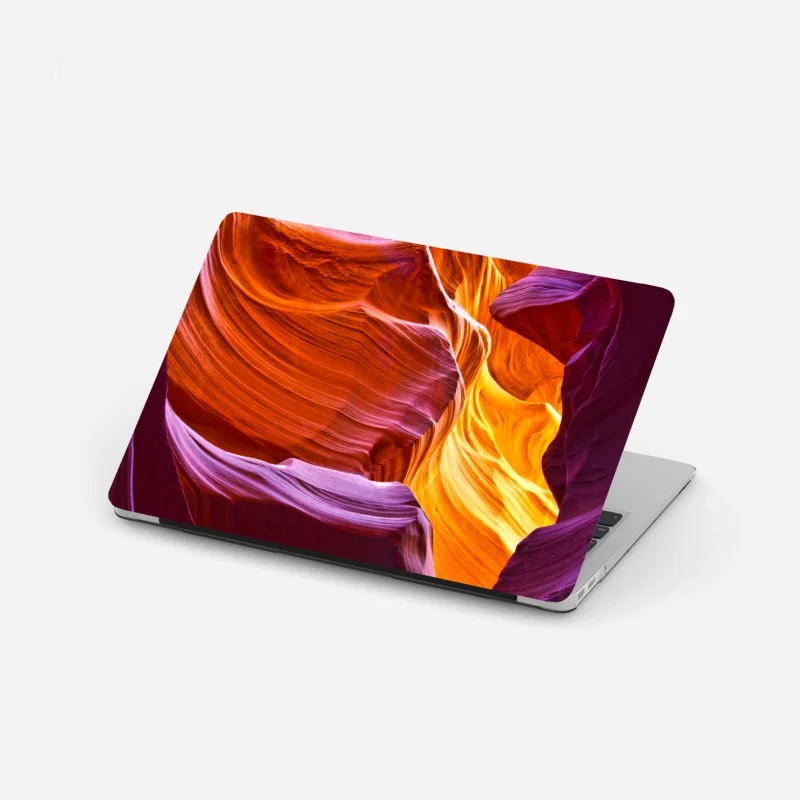 Adesivo per laptop luce dorata nel canyon scolpito