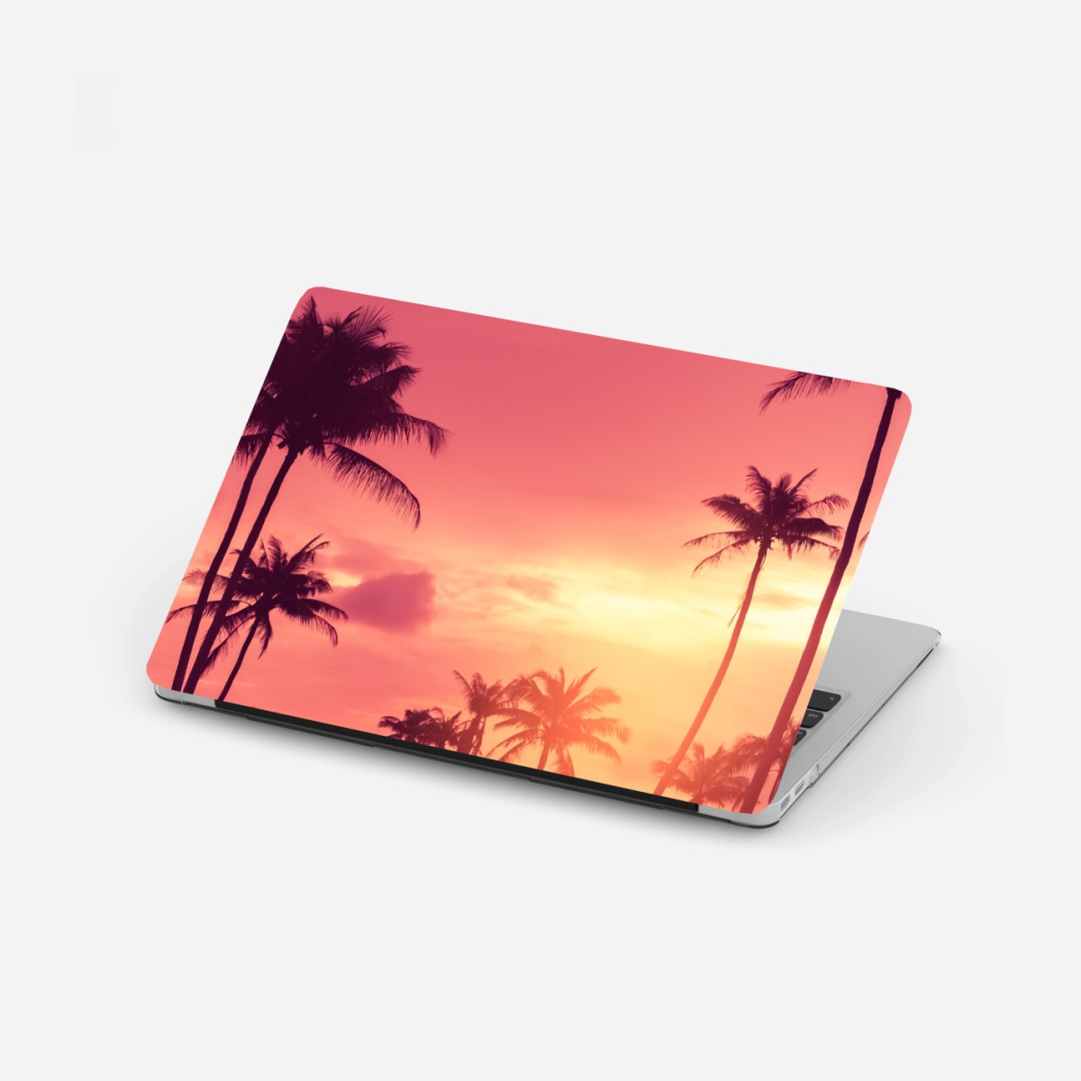 Adesivo per laptop tramonto tropicale con palme in silhouette • Wallissimo®