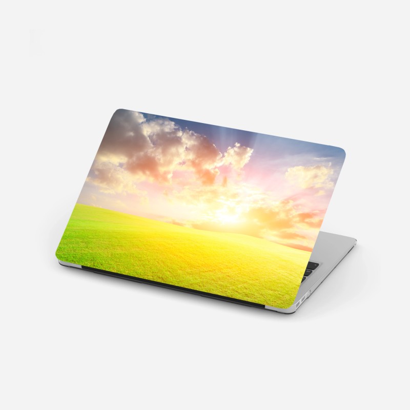 Adesivo per laptop tramonto dorato sul prato infinito