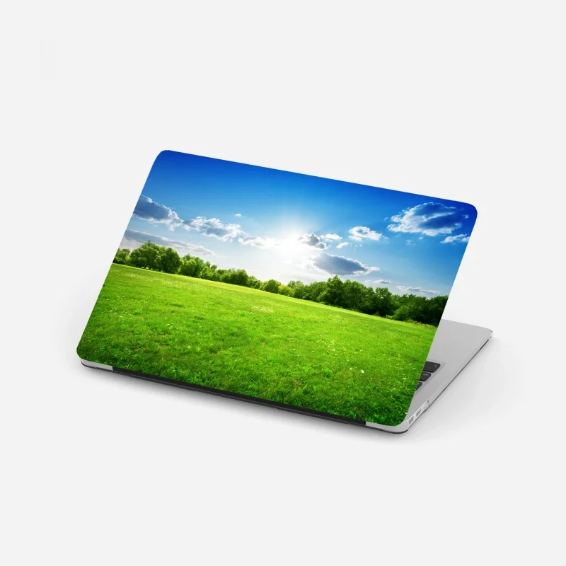 Adesivo per laptop prato verde sotto cielo azzurro