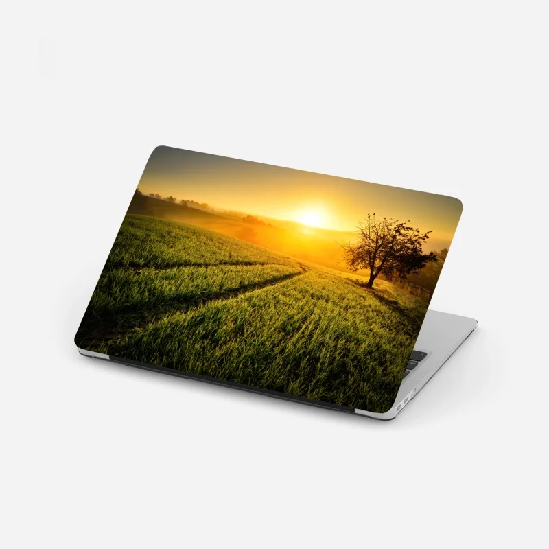 Adesivo per laptop alba dorata sulle colline