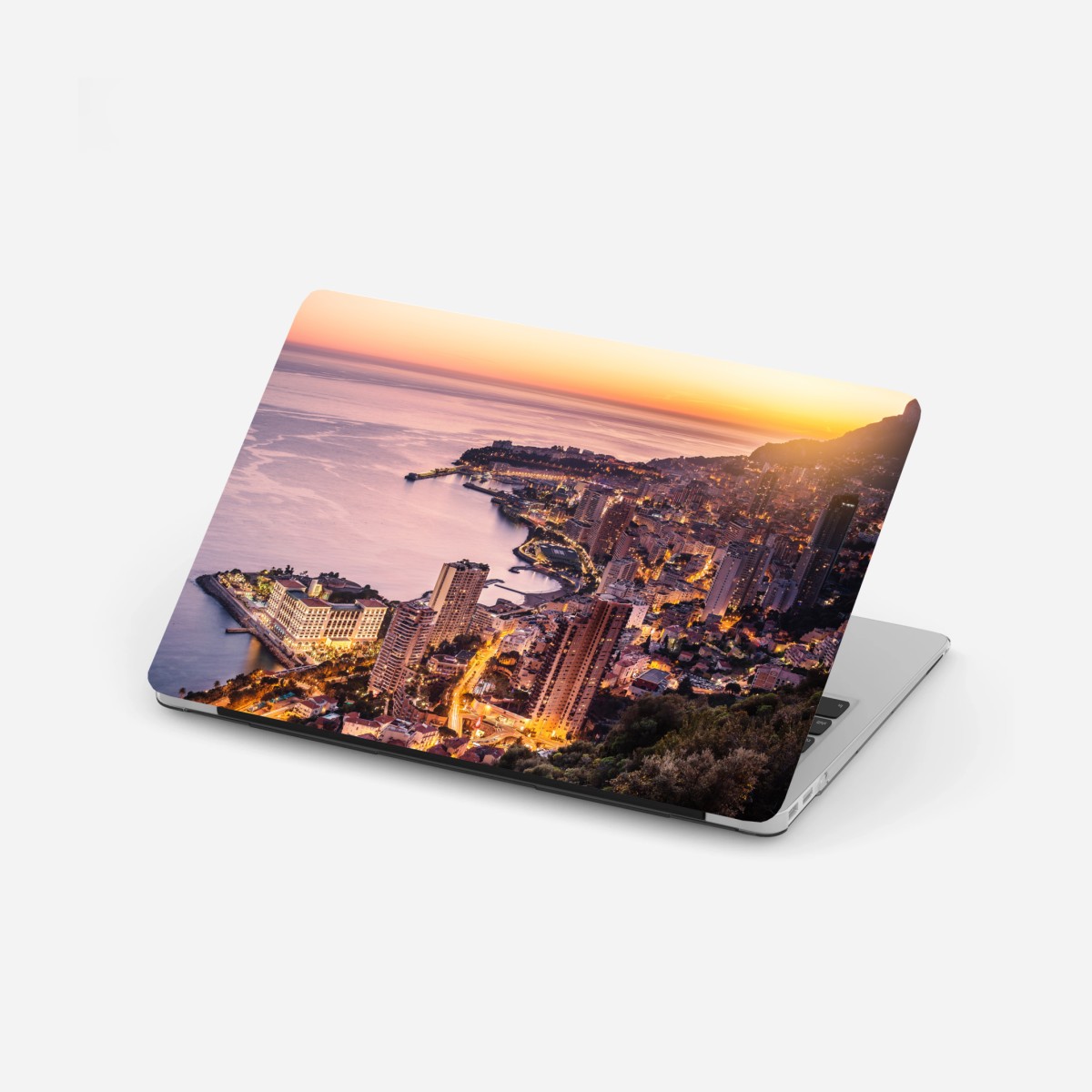 Adesivo per laptop tramonto sulla baia urbana illuminata • Wallissimo®