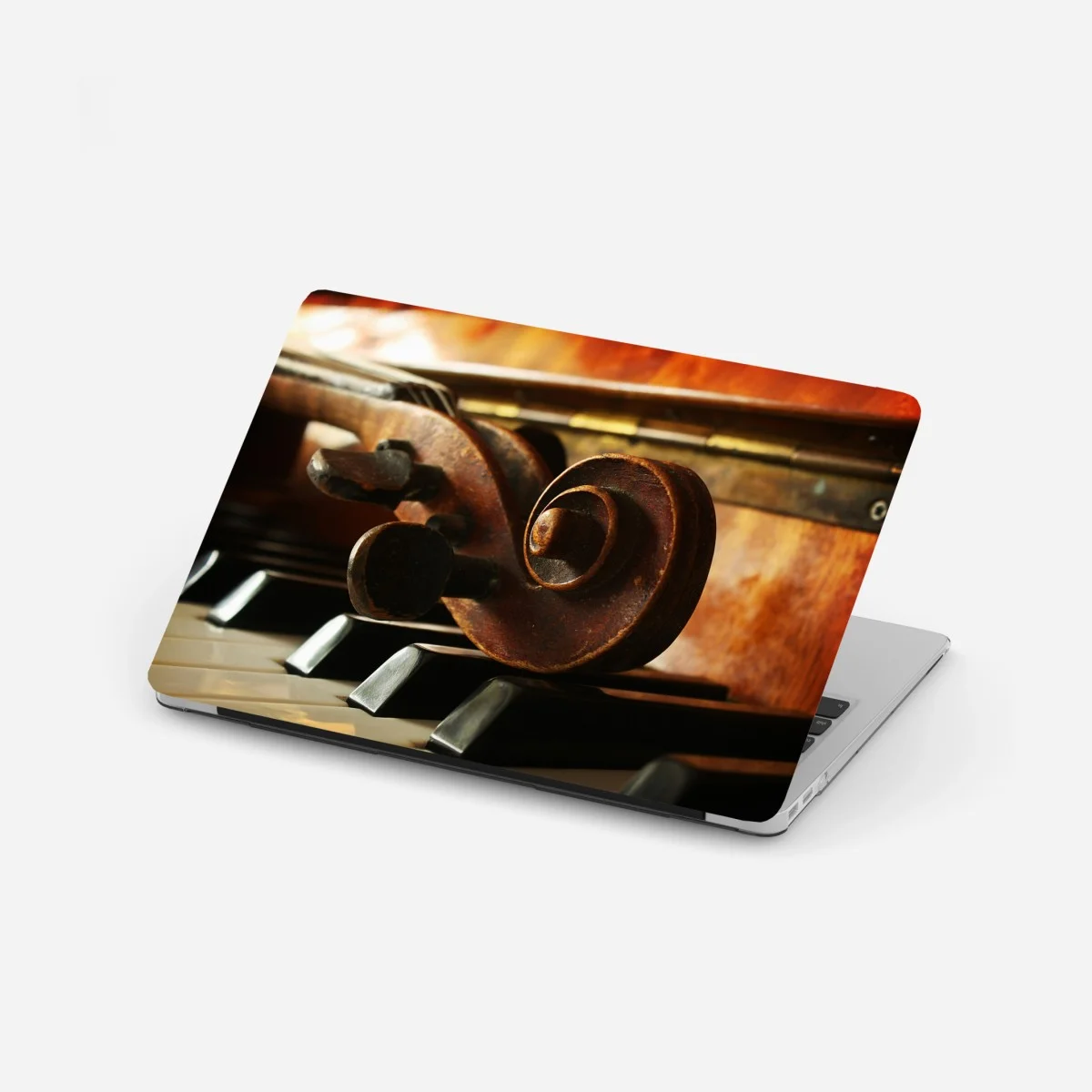 Adesivo per laptop contrasto musicale: violino sui tasti del pianoforte • Wallissimo® Adesivo per laptop contrasto musicale: violino sui tasti del pianoforte • Wallissimo®