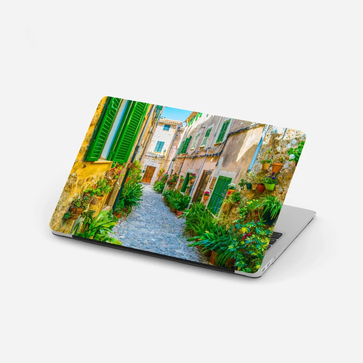Adesivo per laptop vicolo fiorito in pietra • Wallissimo®