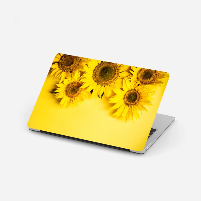 Adesivo per laptop girasoli su sfondo giallo vivace