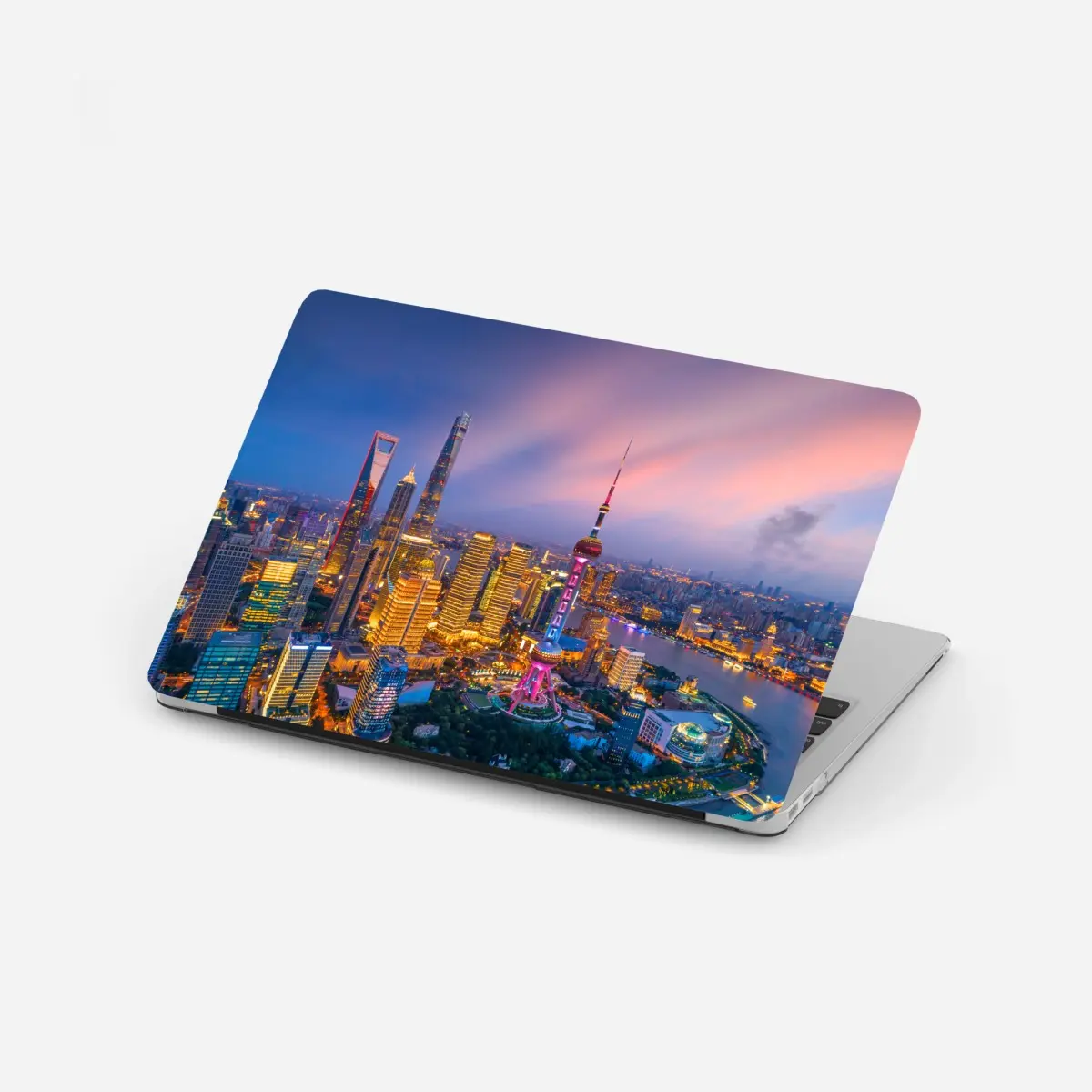 Adesivo per laptop tramonto vibrante sulla skyline di Shanghai • Wallissimo®