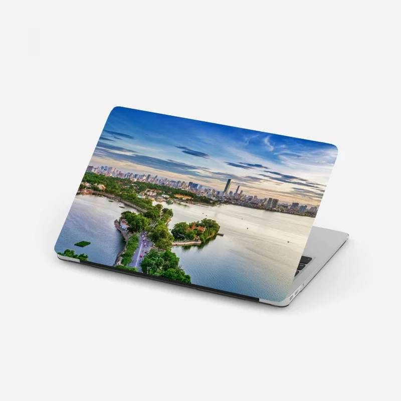 Adesivo per laptop tramonto sul lago con skyline cittadino