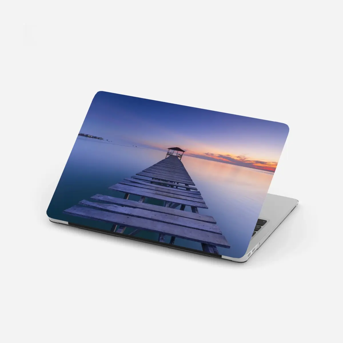 Adesivo per laptop pontile verso l'orizzonte al tramonto • Wallissimo®