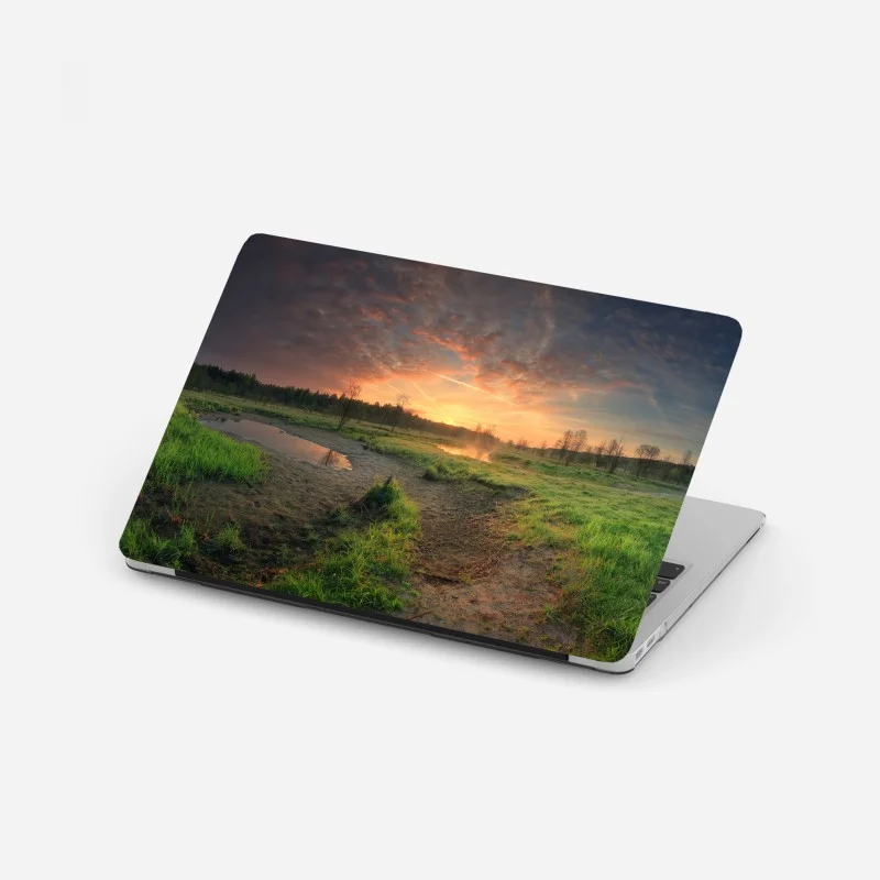 Adesivo per laptop tramonto dorato sulla palude