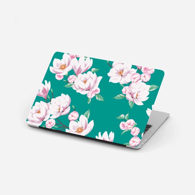 Adesivo per laptop magnolie delicate su sfondo turchese