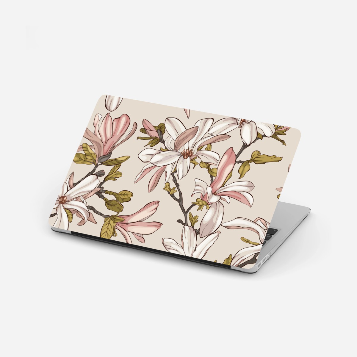 Adesivo per laptop magnolie in fiore su sfondo pastello • Wallissimo®