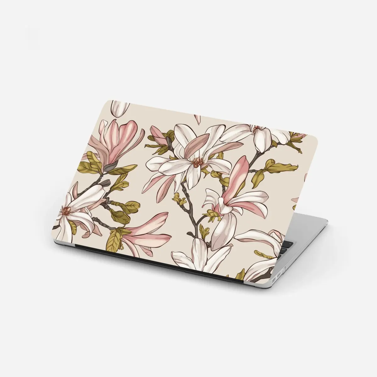 Adesivo per laptop magnolie in fiore su sfondo pastello • Wallissimo®