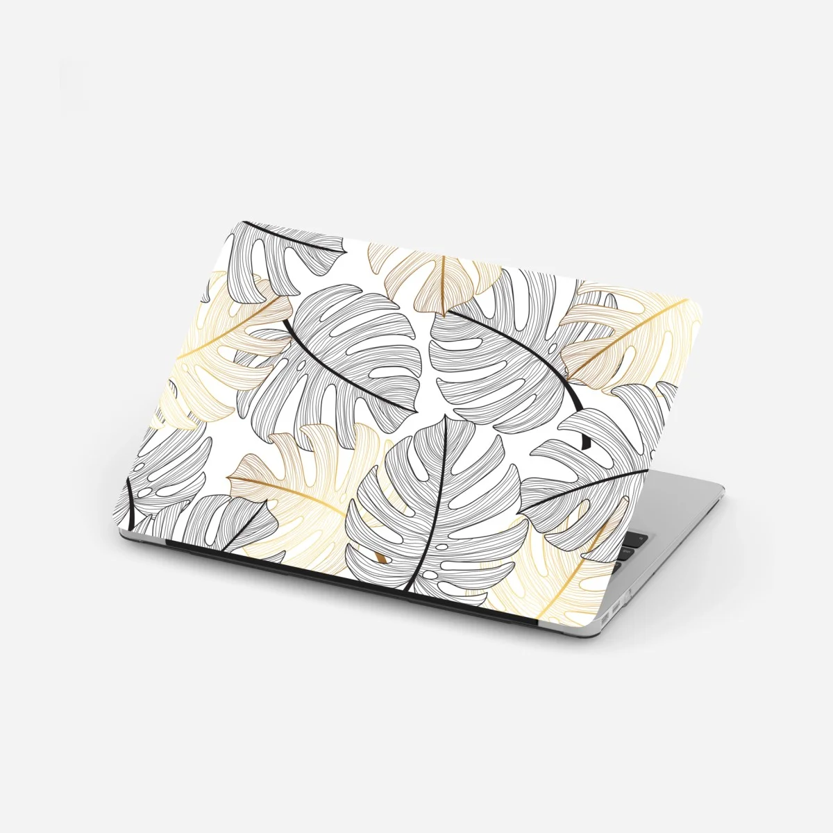 Adesivo per laptop eleganza botanica: foglie di monstera in oro e nero • Wallissimo® Adesivo per laptop eleganza botanica: foglie di monstera in oro e nero • Wallissimo®
