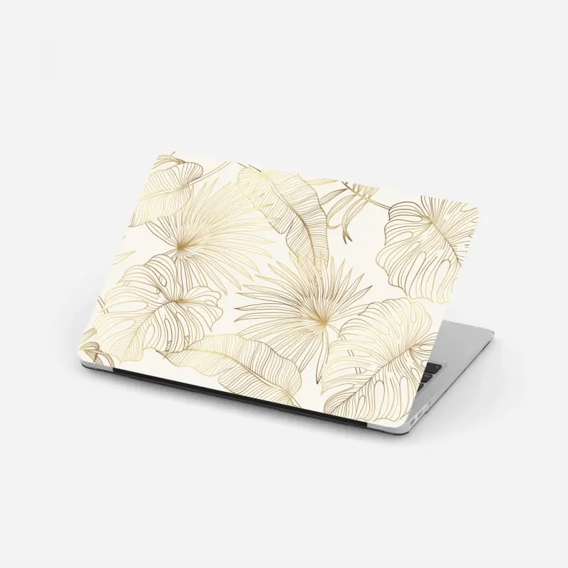 Adesivo per laptop fogliame tropicale dorato su fondo crema
