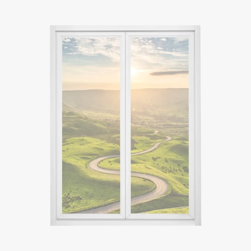 Adesivo per finestra strada serpeggiante al tramonto sulle colline verdi