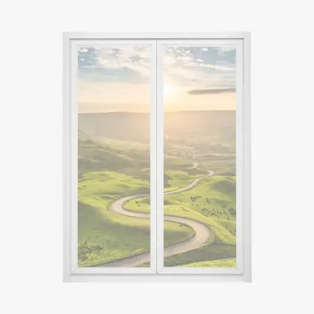 Adesivo per finestra strada serpeggiante al tramonto sulle colline verdi • Wallissimo®