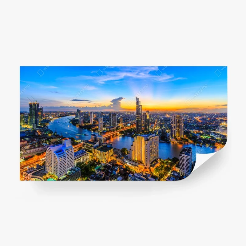 Carta da parati tramonto urbano sul fiume: skyline illuminato
