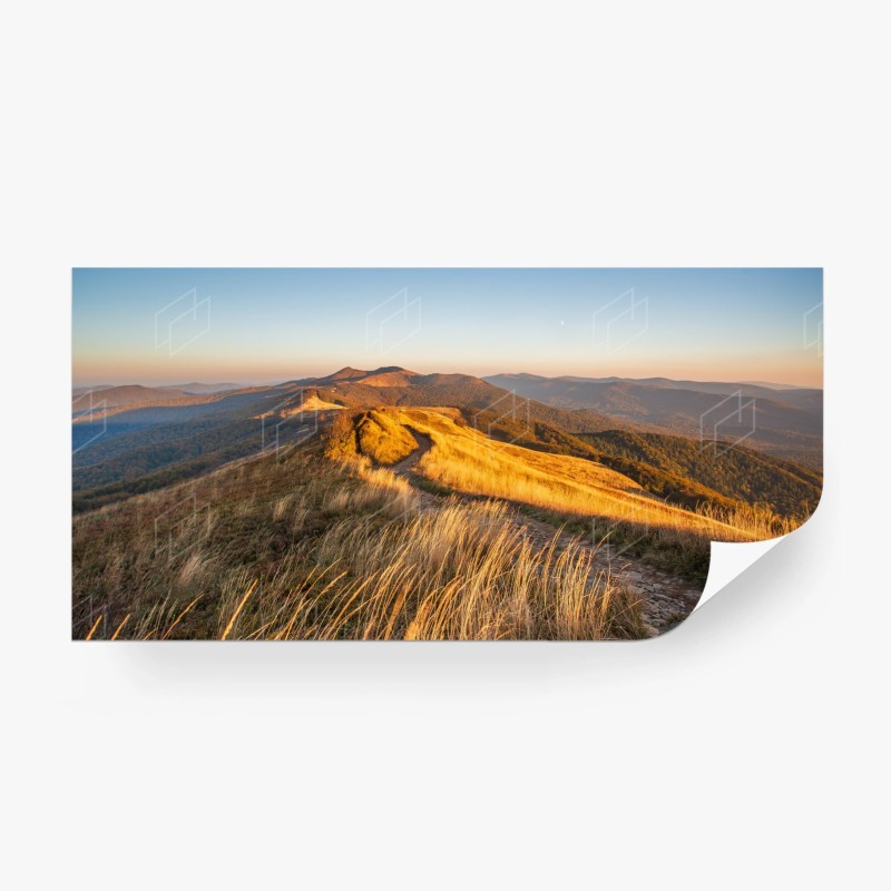 Carta da parati panorama montano al tramonto dorato