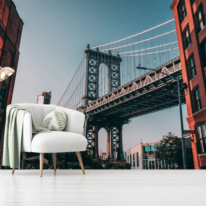 Carta da parati scorcio urbano: ponte di Manhattan tra palazzi in mattoni