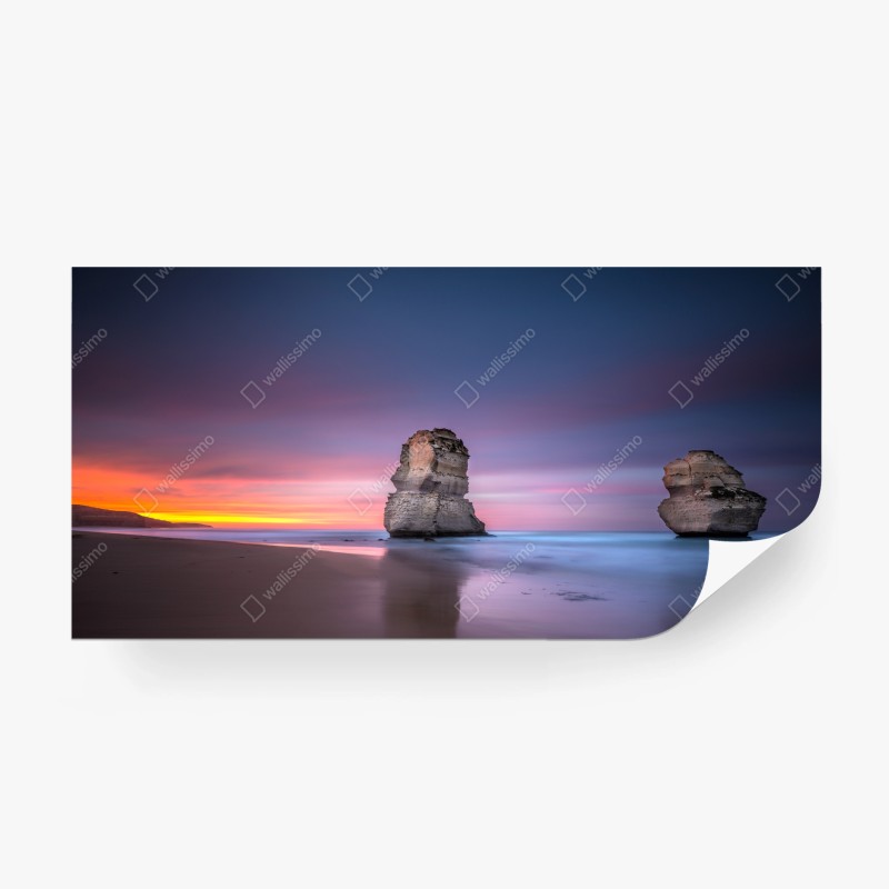 Carta da parati tramonto tra faraglioni sul mare
