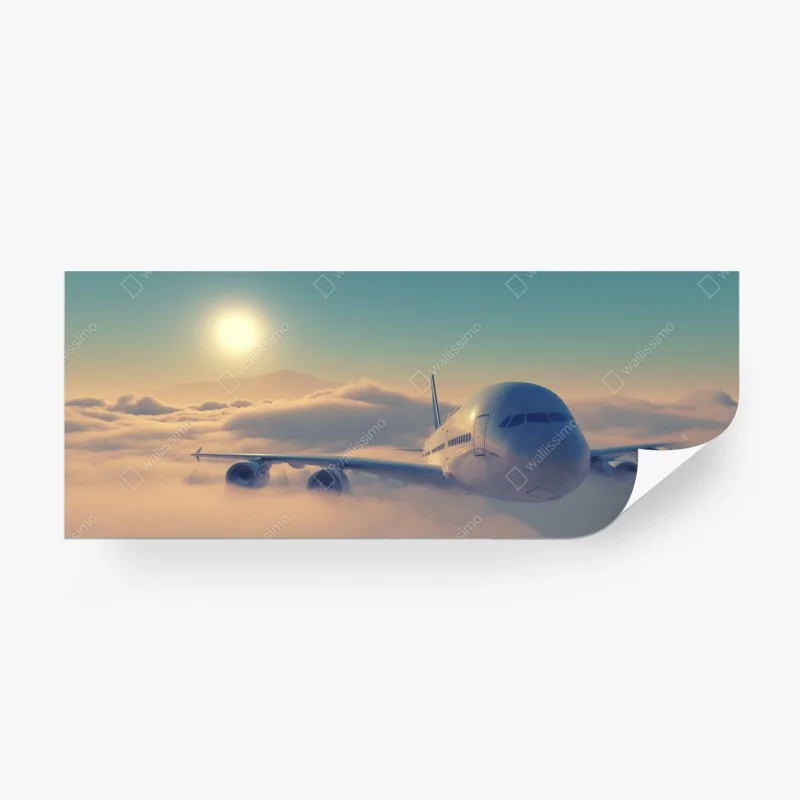 Carta da parati aereo in volo tra le nuvole al tramonto