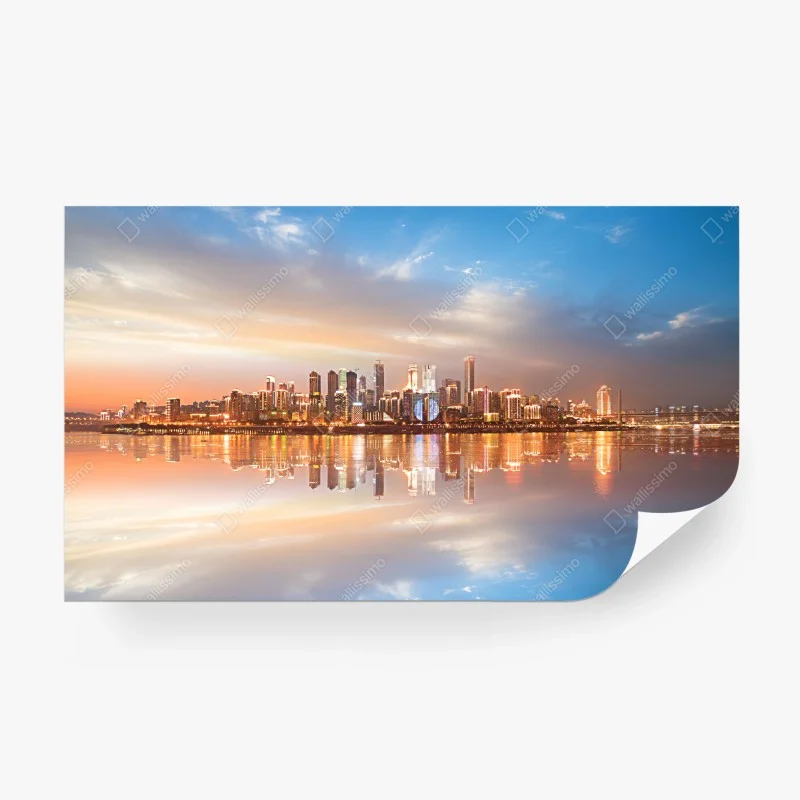 Carta da parati panorama urbano al tramonto riflesso sull'acqua