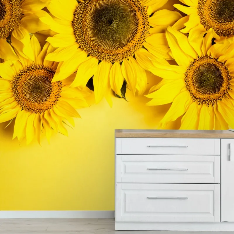 Carta da parati girasoli su sfondo giallo vivace