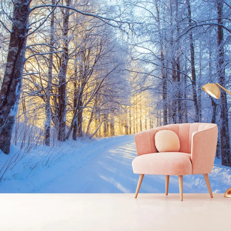 Carta da parati bosco innevato alla luce dorata