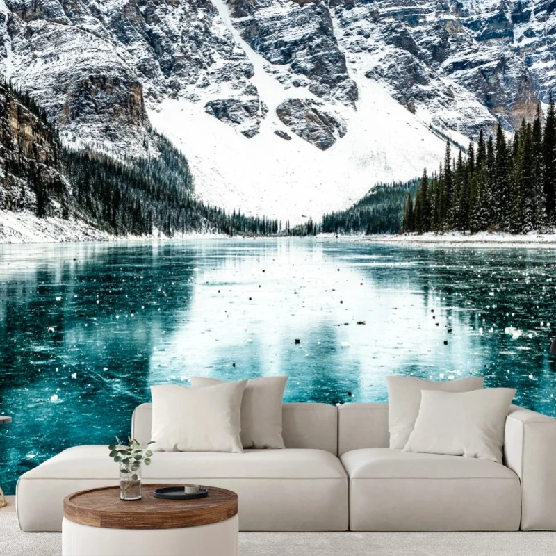 Carta da parati vista montana innevata con lago turchese riflettente