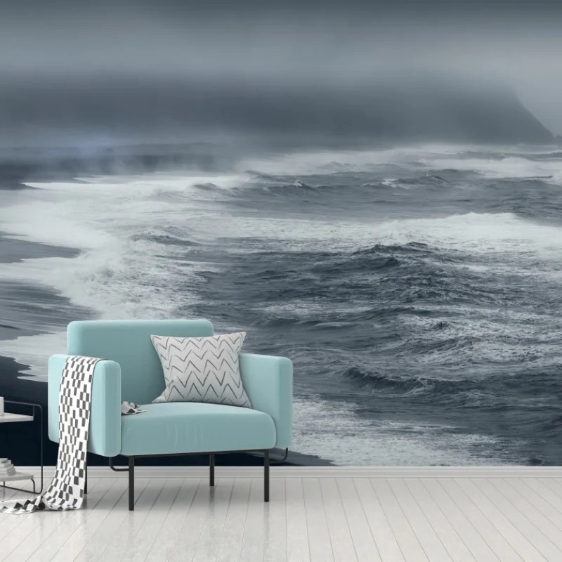 Carta da parati alba tempestosa sulla spiaggia vulcanica d'Islanda